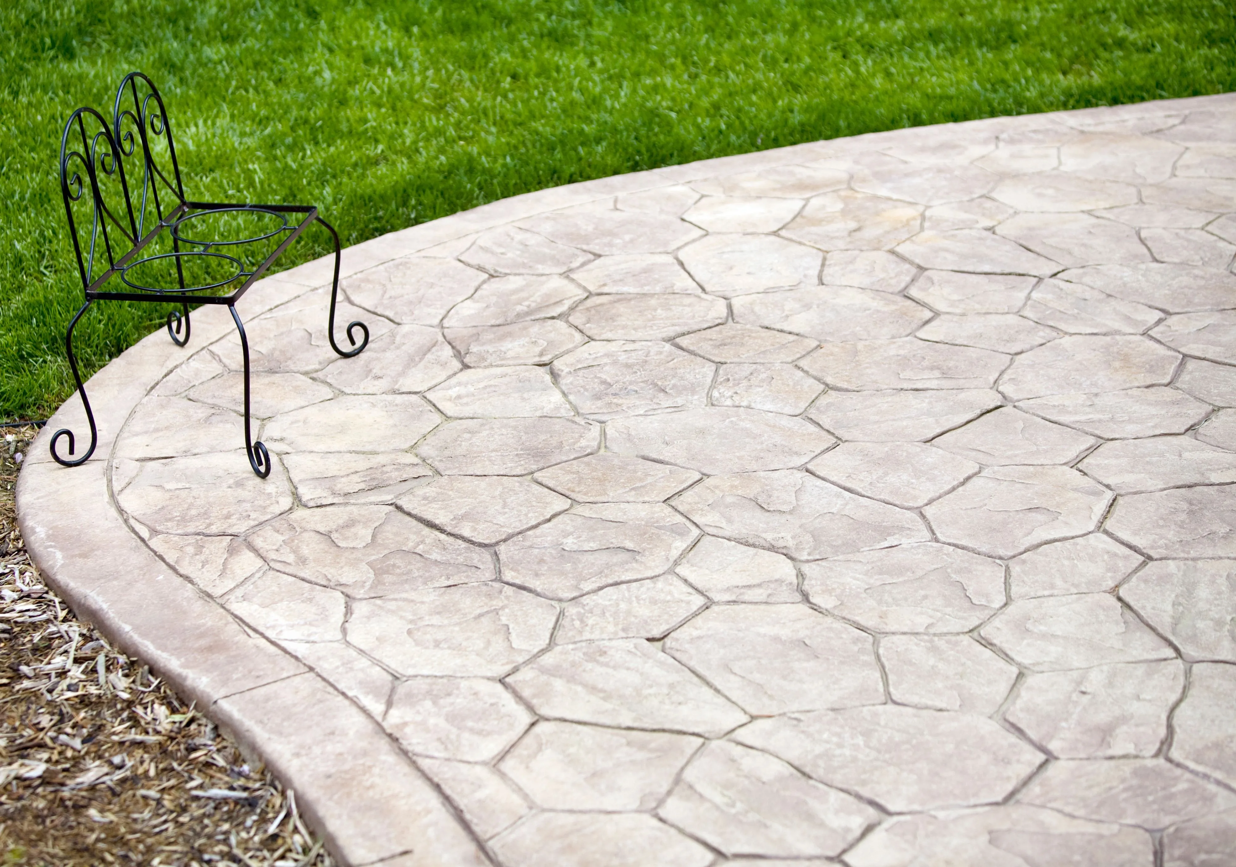 Stamped concrete patio with a hexagonal stone pattern design in a Philadelphia backyard